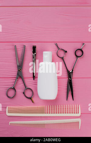 Professionelle friseur Tools auf rosa Hintergrund. Stockfoto