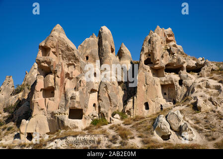 Höhle Häuser in Stein gemeißelt in Göreme, Kappadokien, Türkei Stockfoto