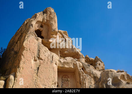 Höhle Häuser in Stein gemeißelt in Göreme, Kappadokien, Türkei Stockfoto