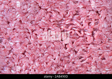 Textur der rote Hackfleisch. Rohkost, forcemeat Hintergrund. Kochen Konzept. Stockfoto