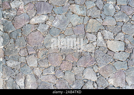 Full-frame Close-up von unebenen Trockenmauer Hintergrund Stockfoto