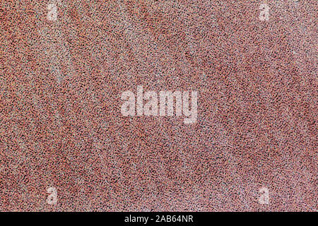 Bunte rosa metallische Textur von Folie, glänzend hell Papier mit Schattierungen bokeh, modernen Hintergrund Stockfoto