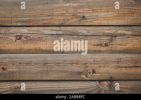 Vintage brown Holz Zaun, Schreibtisch Oberfläche. Natürliche Farbe. Braun alte Planken. Verwittertes Holz, Hintergrund. Risse schäbig Holzbrett, Textur. Stockfoto