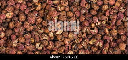Sichuan Pfeffer Hintergrund. Natürliche Gewürze Textur. Gewürze und Zutaten. Stockfoto