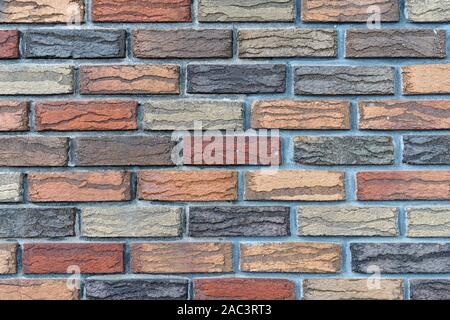 Nahaufnahme von einem bunten Mauer aus bunte Steine Stockfoto