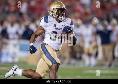 Houston, TX, USA. 30 Nov, 2019. Navy Midshipmen Verteidiger Jamale Carothers (34) zählt einen Touchdown im 1. Quartal eine NCAA Football Spiel zwischen der Navy Midshipmen und das Houston Cougars bei tdecu Stadion in Houston, TX. Trask Smith/CSM/Alamy leben Nachrichten Stockfoto