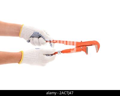 Weiße Handschuhe halten Schlüssel abgeben. Stockfoto