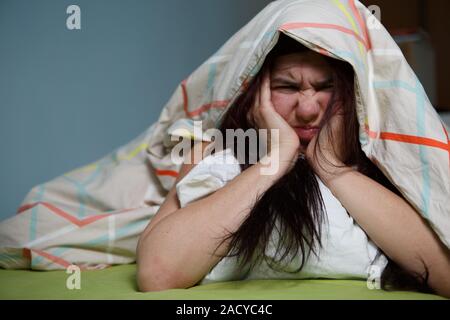 Woman with blanket under her head Stockfoto