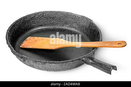 Alten gusseisernen Pfanne mit Holzspachtel Stockfoto