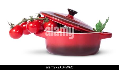 Cherry Tomaten und Petersilie in Kochtopf mit Deckel Stockfoto