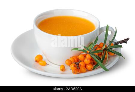 Saft aus Sanddorn in eine Schale mit Beeren Stockfoto