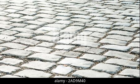 Straße gepflastert mit Pflastersteinen für Ihren Hintergrund Stockfoto