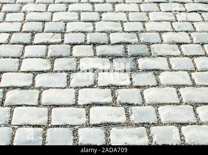 Straße gepflastert mit Pflastersteinen für Ihren Hintergrund Stockfoto