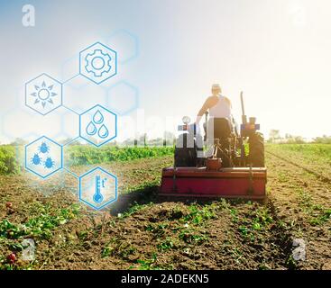 Hohe Technologien und Innovationen in der Agroindustrie. Landwirtschaftliche startup. Innovation. Automatisierung und Verbesserung der Qualität des Ernteguts. Traktor pflegt die Stockfoto