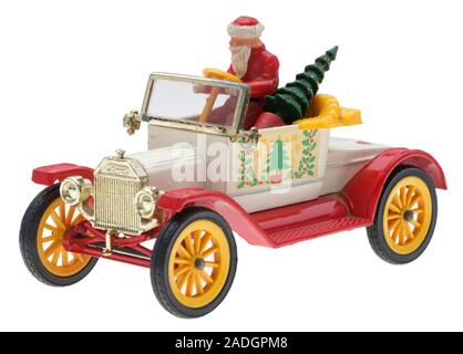 Vater Weihnachten in einem alten Ford Motor Auto. Dinky metall Spielzeug mit Santa und einen Weihnachtsbaum. Stockfoto