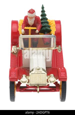 Vater Weihnachten in einem alten Ford Motor Auto. Dinky metall Spielzeug mit Santa und einen Weihnachtsbaum. Stockfoto