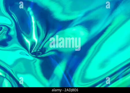 Abstrakte Minze und blaue Flüssigkeit Kunst Hintergrund. Echten holographische Metallfolie Textur mit Kratzern und Unregelmäßigkeiten. Stockfoto