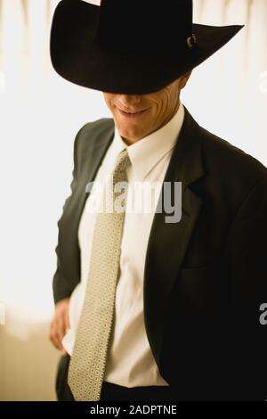 Unternehmer tragen Cowboyhut Stockfoto