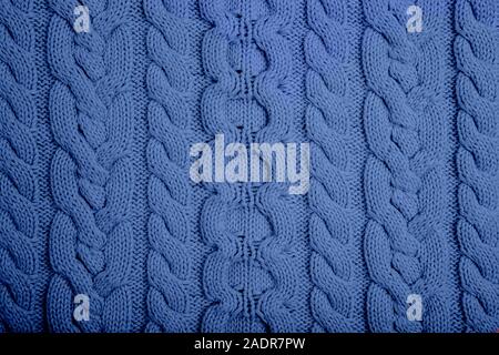 Gewirke Textur. Rosa gestrickt Hintergrund. Moderne Pullover. Farbe des Jahres. 2020 Stockfoto