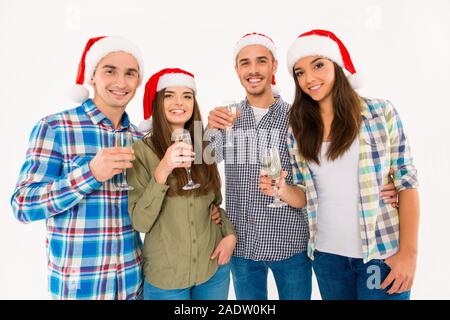 Schöne Menschen in santa Hüte Weihnachten feiern mit Champagner Stockfoto