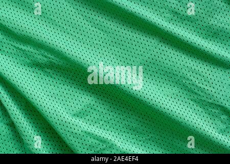 Fabric Textur. Grüner Stoff mit Falten. Rauheiten und Wellen auf der Oberfläche. Stockfoto