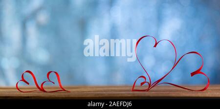 Valentines Tag Hintergrund-Ribbon geformte Herzen bokeh Hintergrund Stockfoto