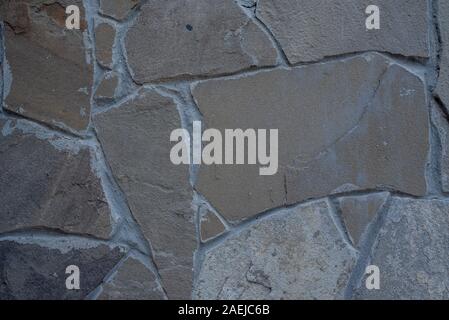 Detail einer Mauer aus Stein mit unterschiedlicher Größe der Felsen. Hintergrund der steinernen Mauer Textur. Naturstein Wand Textur für Hintergrund. Die Textur der Wal Stockfoto