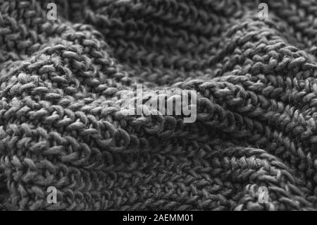 Monochrome Gestrick Nahaufnahme. Gestrickte wolle Hintergrund. Handgefertigt. Close Up. Stockfoto