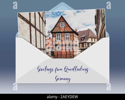 Eine geöffnete Umschlag mit einem Foto und Bildunterschrift Grüße aus. Fachwerkhaus Finkenherd 3, in der Gasse unter dem Schlossberg, Finkenherd Quedl Stockfoto