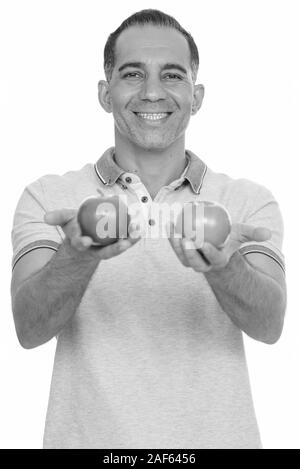 Reifen glücklich Persischen Mann mit roten und grünen apple Stockfoto