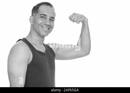 Reifen glücklich Persischen Mann verbiegen Arm für Fitnessraum flexing Arm bereit Stockfoto