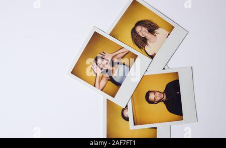 Instant Film Fotos von jungen Frauen und Männern für die Modellierung Casting im Studio auf weißem Hintergrund Stockfoto