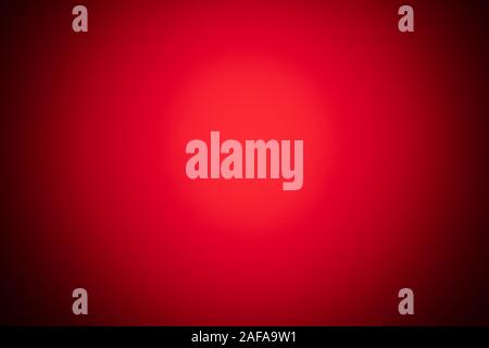 Red verschwommenen Hintergrund mit starken Gradienten und Vignette. Stockfoto