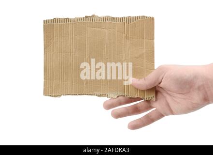 Weibliche hand mit einem Stück Pappe isoliert auf weißem Stockfoto