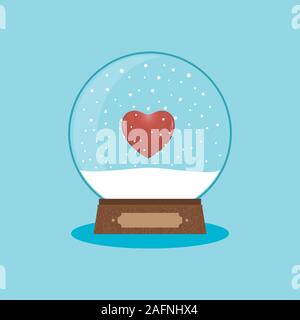 Schneekugel auf einem blauen Hintergrund, Herz innen. Frohe Weihnachten und guten Rutsch ins neue Jahr. Stockfoto