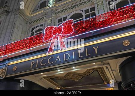 Piccadilly Arcade, New Street, Birmingham, West Midlands, England, UK-Einzelhandelsgeschäfte zu Weihnachten - dekorativer Schleife Stockfoto