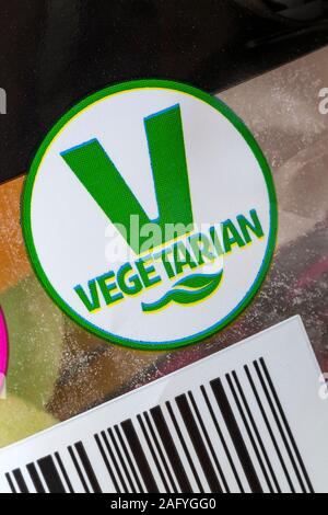 V vegetarisches Symbol Logo auf der Packung Stoßfänger Beutel fliegende Untertassen Sorbet gefüllt wafer Scheiben Stockfoto