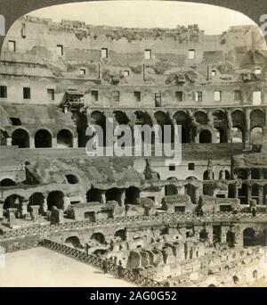 Der tupendous Innenraum des Kolosseum, mit dens von wilden Tieren, Rom', c 1909. Flavischen Amphitheater in Rom, für Gladiatorenkämpfe Wettbewerbe und öffentliche Brillen verwendet, gebaut von Travertin Kalkstein. Begonnen unter Kaiser Vespasian im AD 72 und AD 80 abgeschlossen unter seinem Nachfolger und Erben, Titus. Auf einem Sun Skulptur stereoskop von Underwood&Amp gemacht angesehen werden; Underwood. [Die Rose Stereograph Unternehmen, Melbourne, Sydney, Wellington & Amp; London, c 1909] Stockfoto