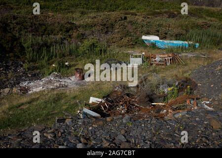 Easdale war Schottland's kleinste dauerhaft - Innere Hebriden Insel mit einer ständigen Bevölkerung von rund 60 Personen im Jahr 2019 bewohnt. Die Insel ist autofrei und die über die benachbarte Insel Seil von einem Passagier Fähre. Es war der Ort der jährlichen Welt Stein Skimming Weltmeisterschaften, die jedes Jahr im September in einem der überschwemmten ehemalige Steinbrüche auf der Insel abgehalten wurde. Stockfoto