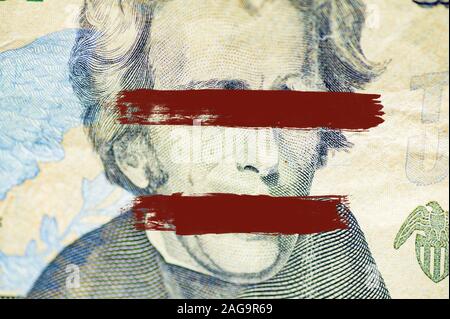 Nahaufnahme des Andrew Jackson Gesichts auf Dollarschein Mit über Augen und Mund gemalten Linien Stockfoto