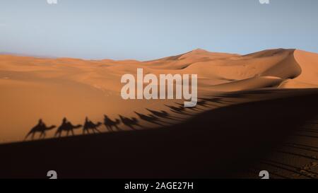 Der Schatten der Kamele und ihrer Reiter streckte sich auf die Wüstendünen Stockfoto