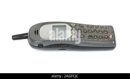 Altes Mobiltelefon auf weißem Hintergrund mit Freistellungspfad isoliert Stockfoto