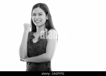 Studio shot Der glückliche junge schöne Frau lächelnd, während sie motiviert Stockfoto