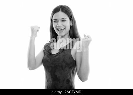 Studio shot Der glückliche junge schöne Frau lächelnd, während sie aufgeregt Stockfoto