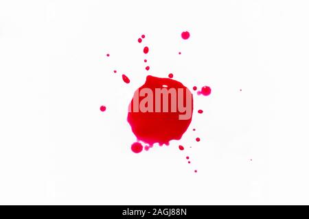 Einen Tropfen Lack auf einem weißen Hintergrund. Stockfoto