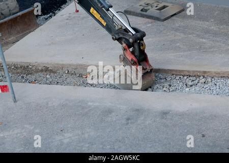 Straßenbau mit Bagger. Straße Gebäude Stockfoto