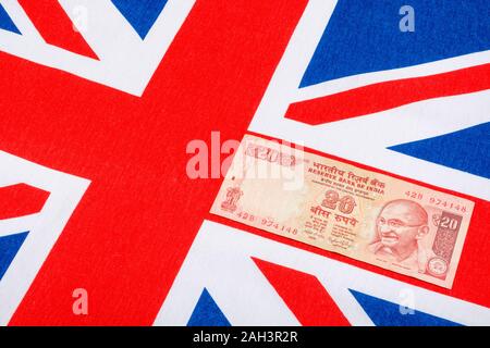 Im alten Stil 20 Indische Rupie Banknoten/Rechnung & Union Jack. Für Indien, Rupie Wechselkurs, Indien Wirtschaft, Indien Großbritannien exportiert, Indien UK Zahlungsbilanz. Stockfoto