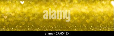 Gelbe herzförmige Glitter bokeh Abstrakt Hintergrund Stockfoto