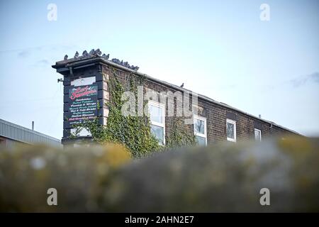 Sonnenaufgang am Ormskirk ist eine Stadt in West Lancashire, England, interessante Gebäude an der Railway Road Gehäuse der Earl Of Sandwich Business Stockfoto