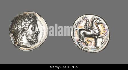 Antike Griechische. Tetradrachme (Münze) Darstellung des Gottes Zeus. 359 v. Chr. - 336 v. Chr.. Pella. Silber Vorderseite Kopf des Zeus laureate nach rechts, luxuriöse kurze beardReverse Junge Jockey reitet Pferd tänzelt auf exergue Linie, hält Palm über dem Pferd headThe Kopf des Zeus auf der Vorderseite zu Philip's behaupten, dass seine Familie von Gott abstammen. Auf der Rückseite Philip gedacht sein Sieg im Rennen der Olympischen Spiele. Das offizielle Protokoll der vierjährige Spiele zu Ehren des Obersten Griechischen Gott Zeus auf ein Heiligtum zu Ihm bei Olympia in 776 v. Chr. begann. Mit wenigen Unterbrechungen, nahmen sie p Stockfoto